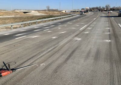 Multiple spots of concrete deep foam injection on a highway
