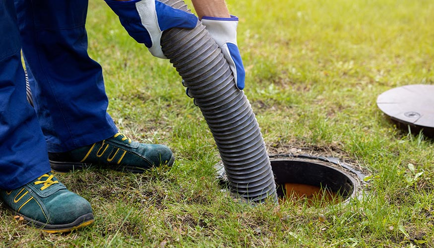 using a hose to drain water in yard